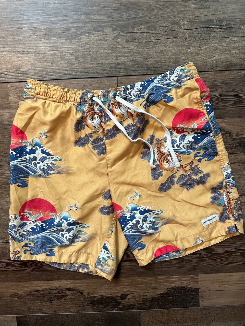 Modern Amusement Mustard Swim Trunks with Blue Wave & Red Sun Print